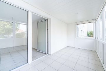 Wintergarten mit Zugang in das Wohnzimmer